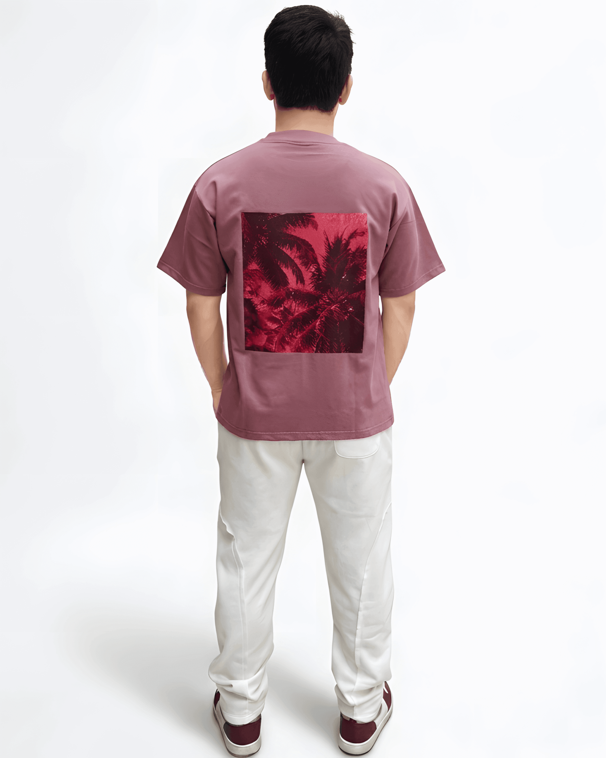 Back view of pink drop shoulder t-shirt on model