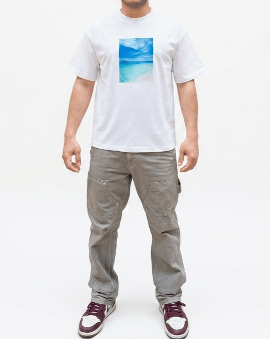 White oversized ocean graphic t-shirt front view showing full blue ocean print design